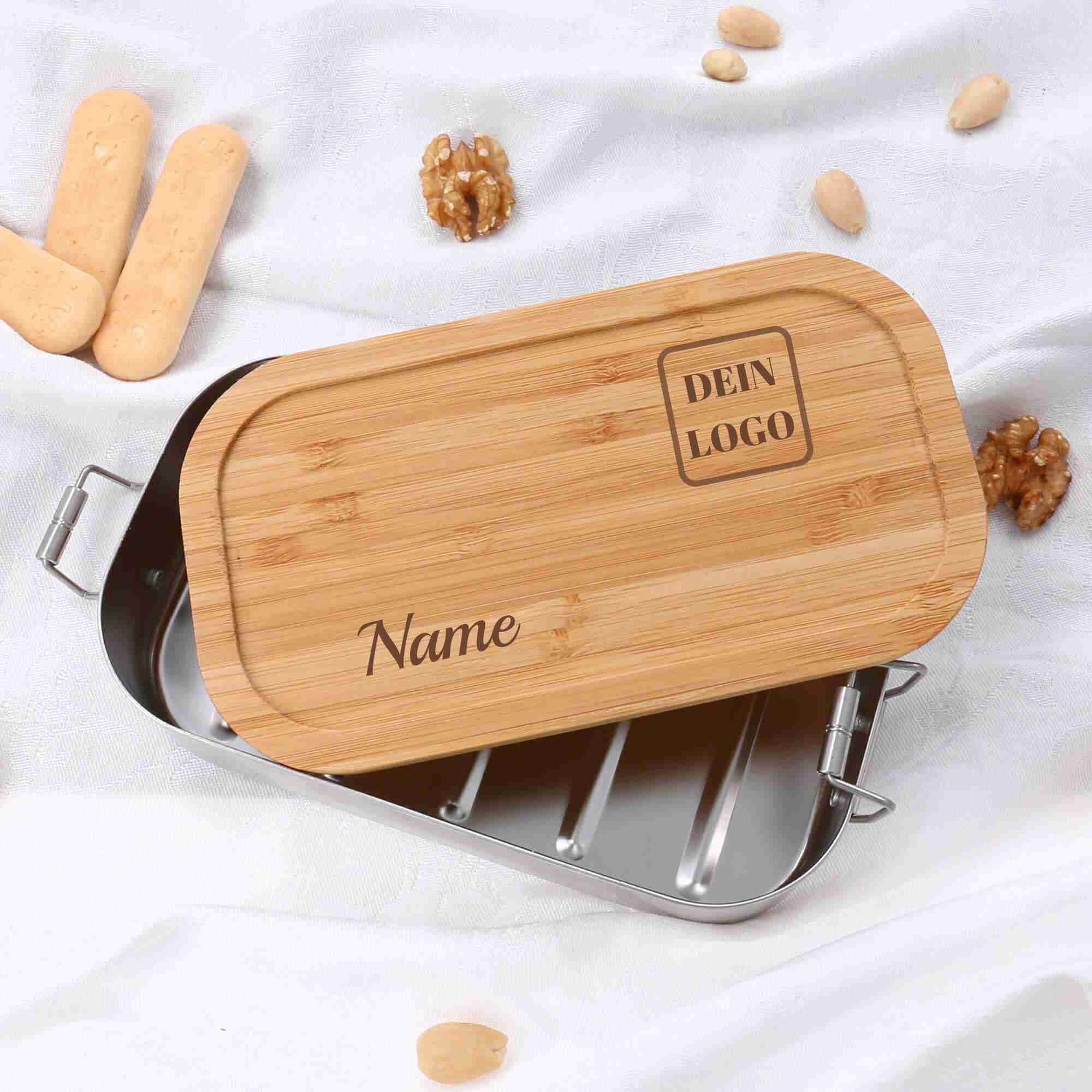 Logo Lunchbox aus Edelstahl und Holz Edelstahl Lunchbox mit Logodesign nach Kundenwunsch durch Lasergravur in den Bambusdeckel eingraviert und personalisiert durch Namen nach Wunsch